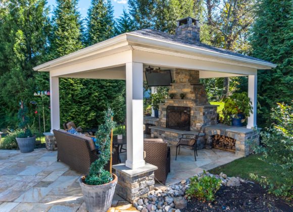 Pavilion installation with sitting area, fireplace, and TV