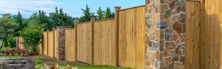 Hardscaping wood fence and stone columns