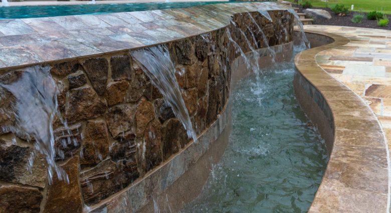 Pool retaining wall and water feature landscape installation in Glenelg