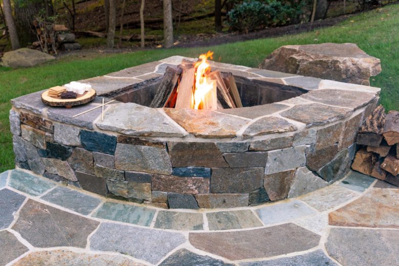 Small corner patio outdoor fireplace hardscaping in Sykesville, MD