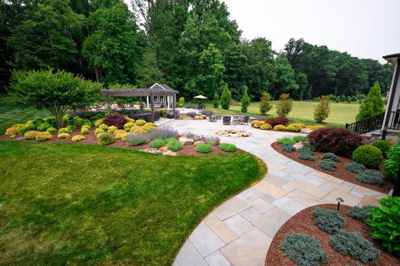 Landscape services in Dayton, MD after installing new shrubbery and hardscaping features